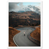 a person riding a skateboard down a curvy road