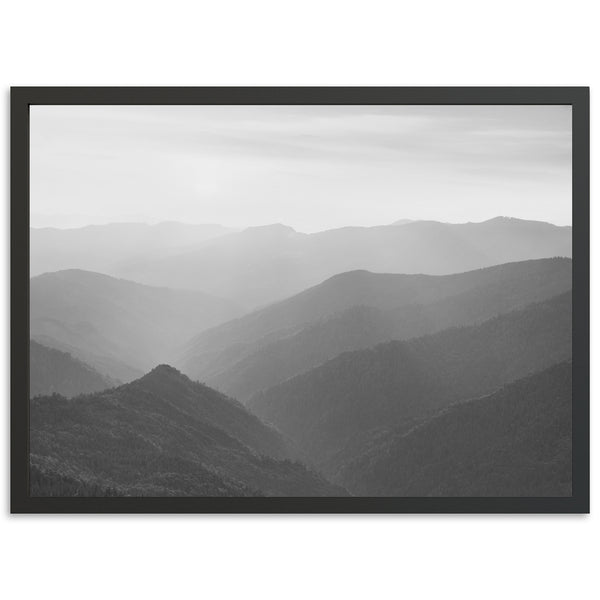 a black and white photo of a mountain range