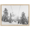 a black and white photo of a ski lift