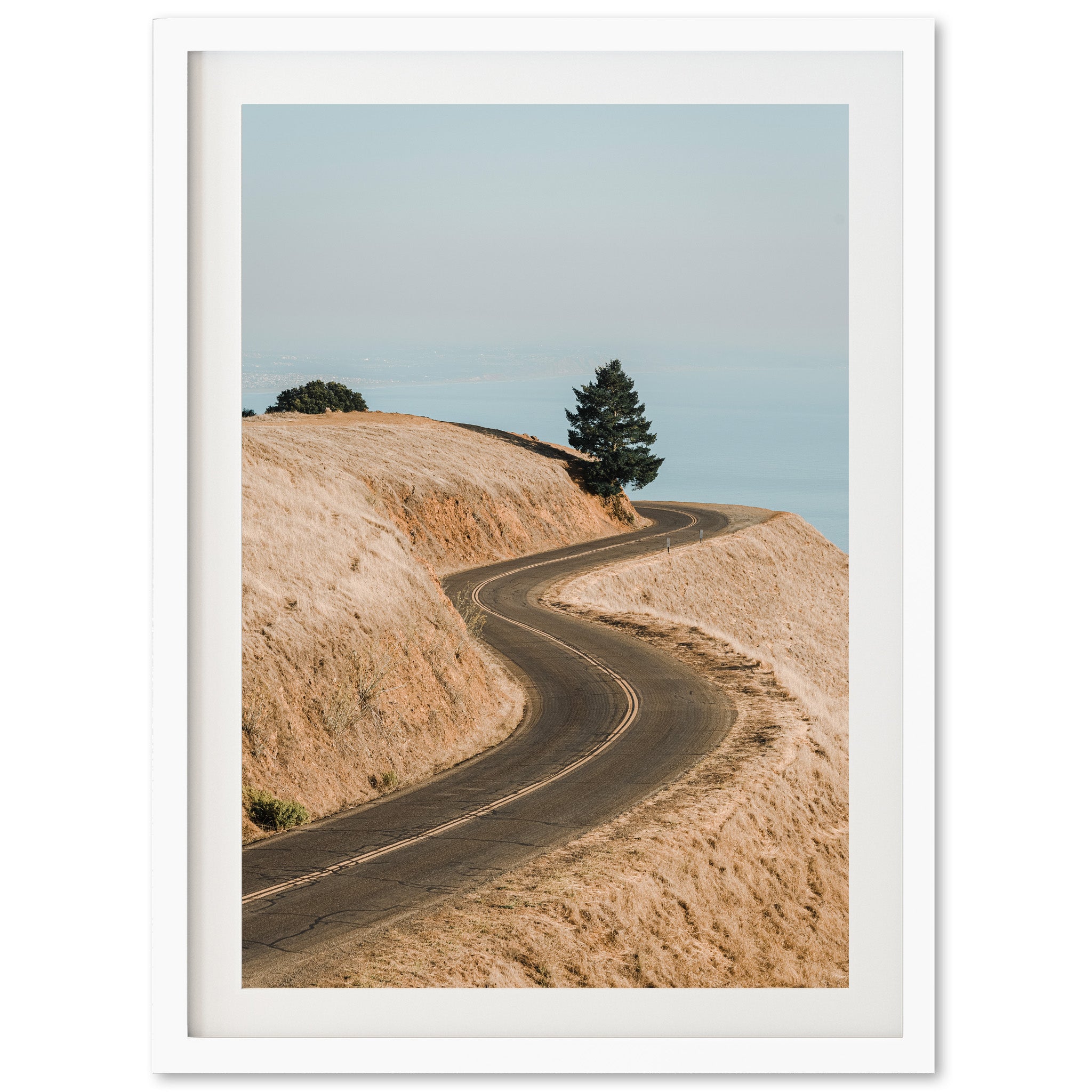 a picture of a dirt road going up a hill