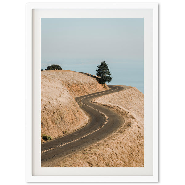 a picture of a dirt road going up a hill