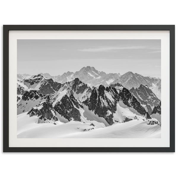 a black and white photo of a mountain range