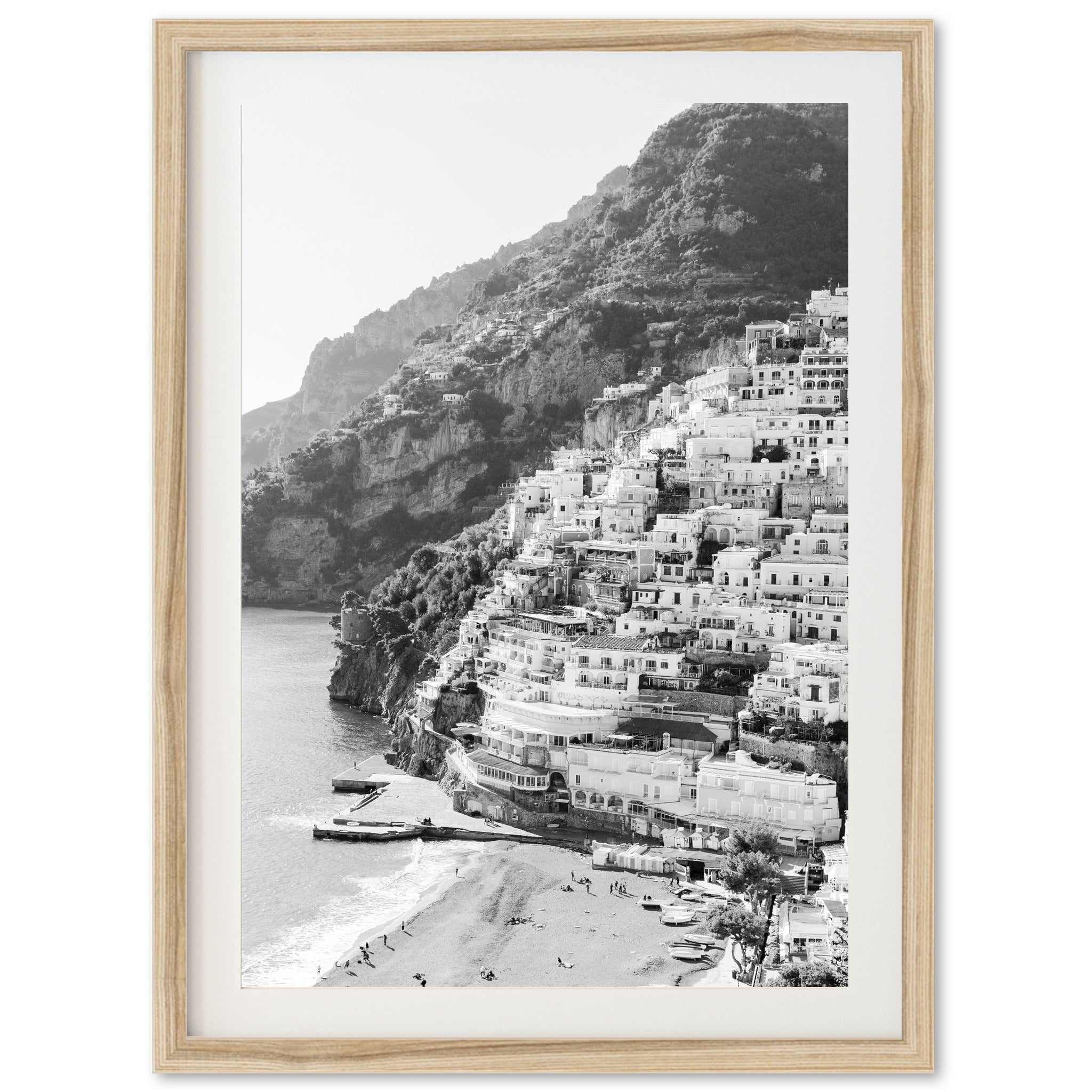 a black and white photo of a beach with houses on it