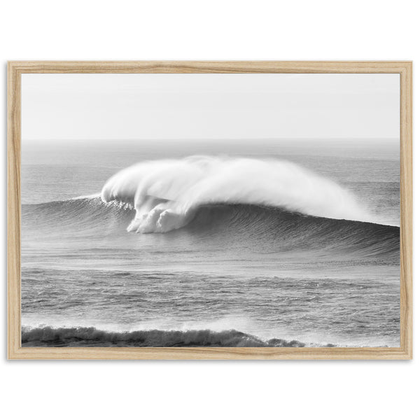 a black and white photo of a large wave