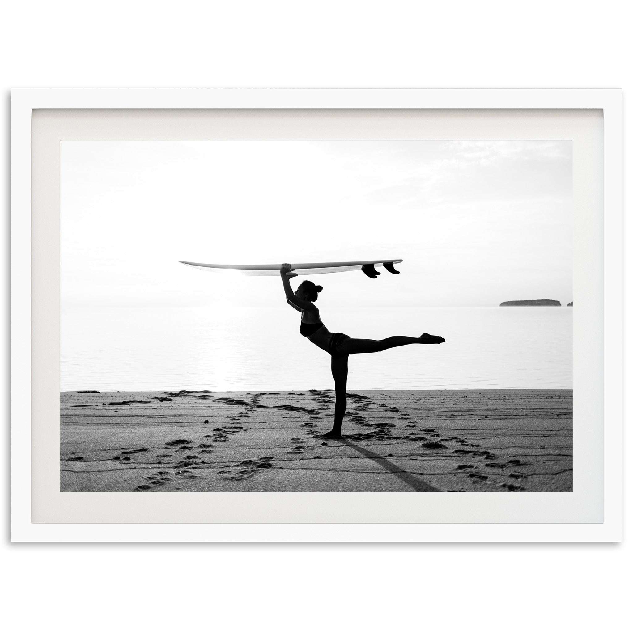 a man holding a surfboard over his head on a beach