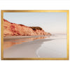 a picture of a person walking on the beach