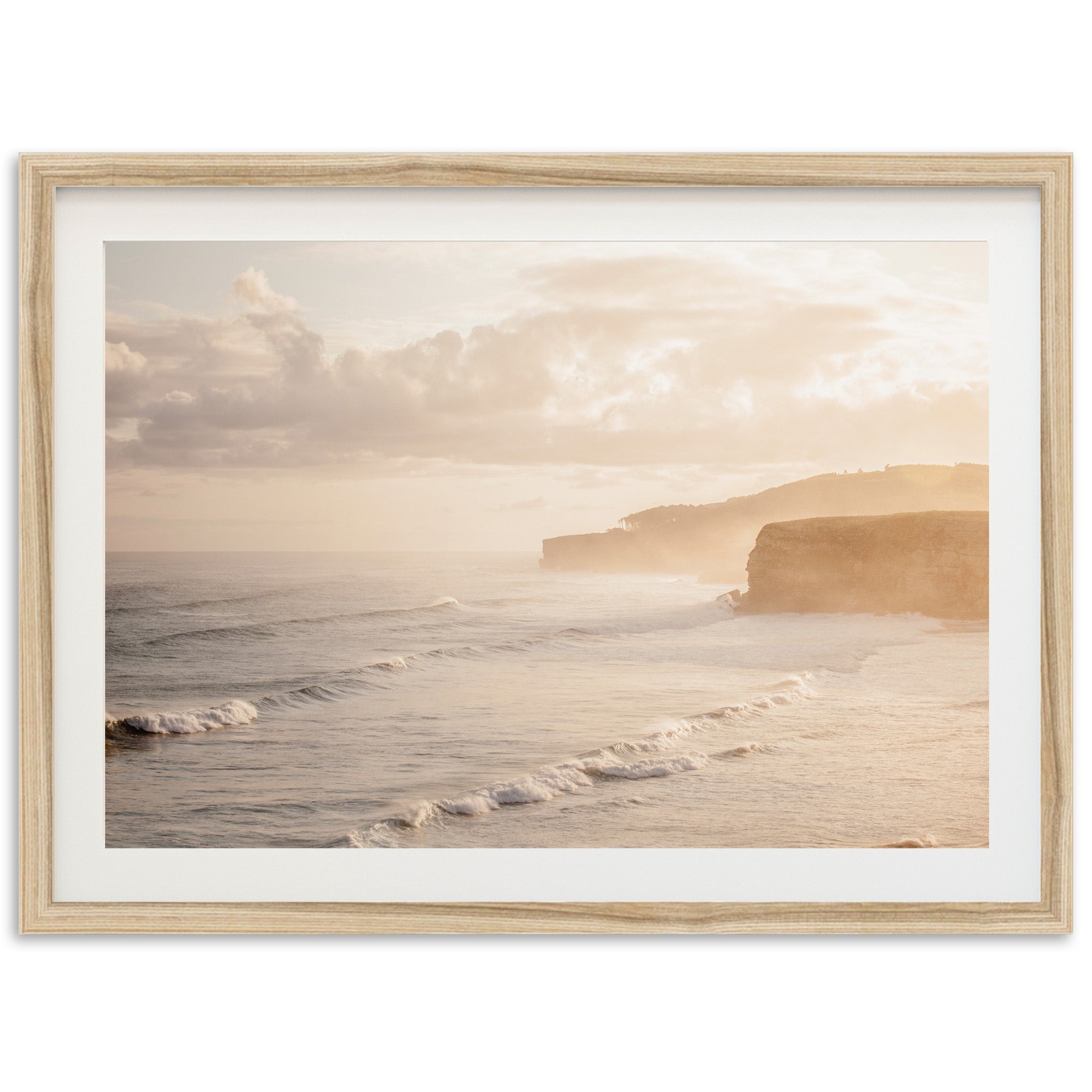 a picture of a beach with a cliff in the background