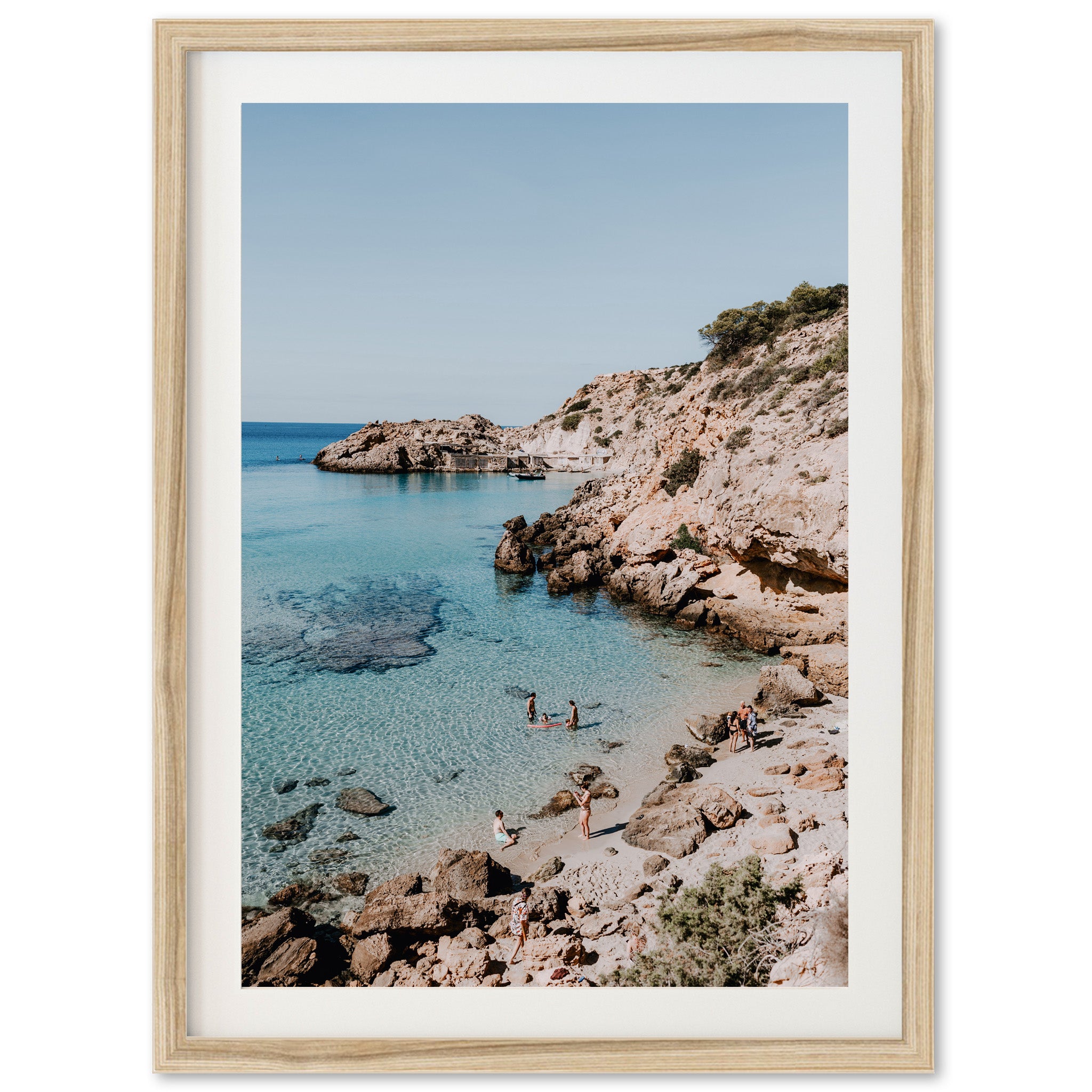 a picture of a beach with people swimming in the water