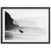 a black and white photo of a person holding a surfboard