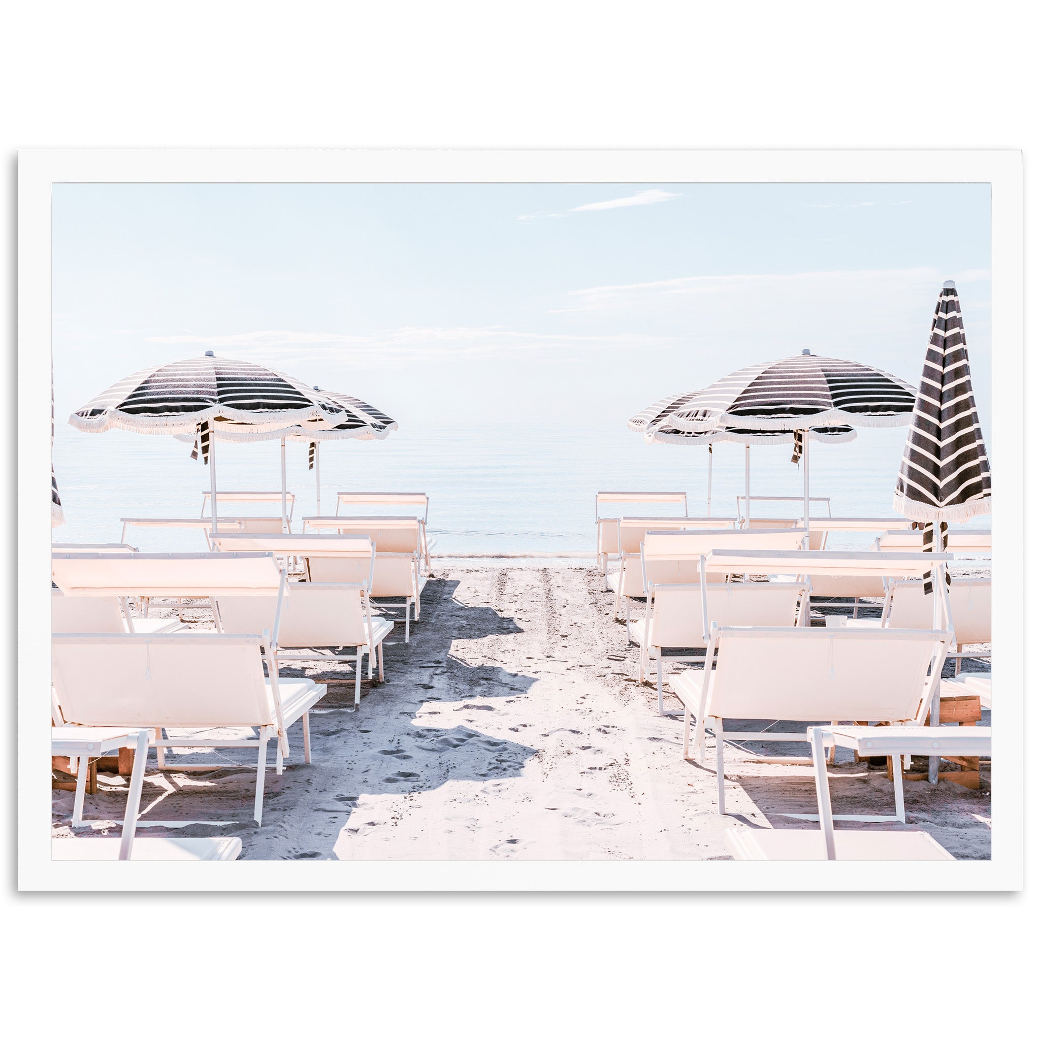 a row of beach chairs with umbrellas over them