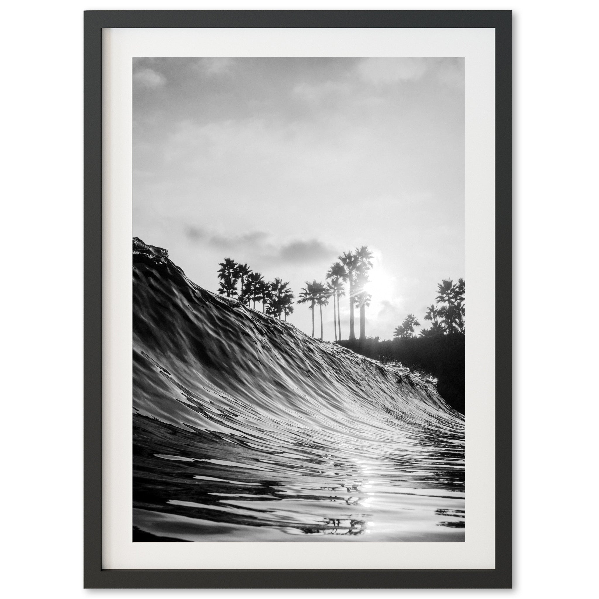 a black and white photo of a wave