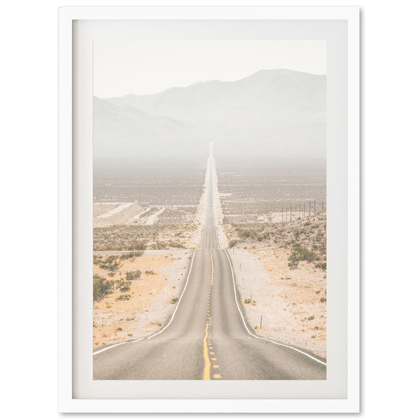 a picture of an empty road in the desert