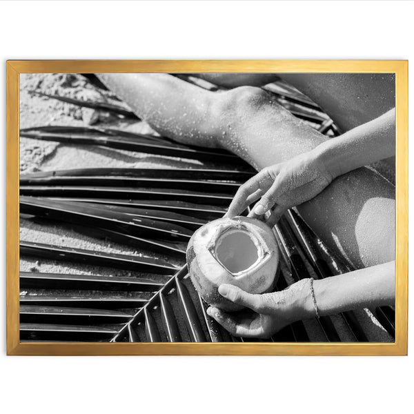 a black and white photo of a person holding a cup