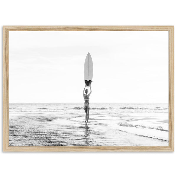 a person holding a surfboard on top of a body of water