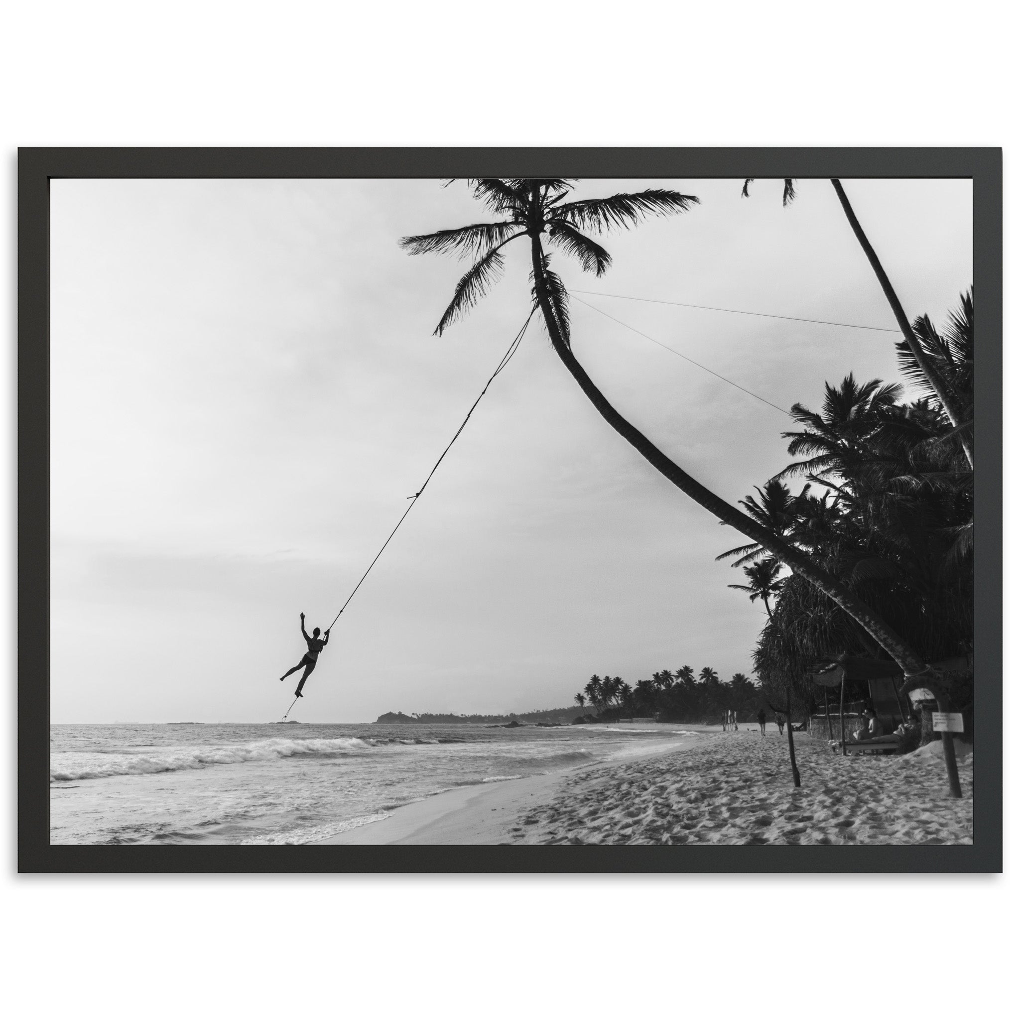 a black and white photo of a person on a rope