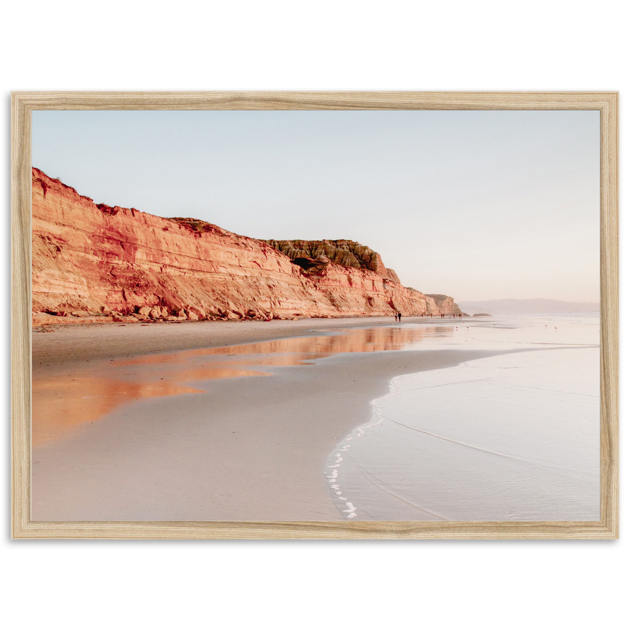 a picture of a person walking on the beach