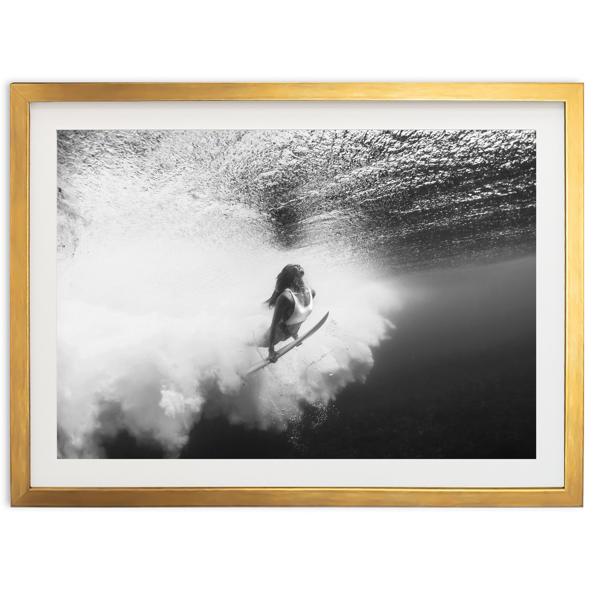 a black and white photo of a person on a surfboard