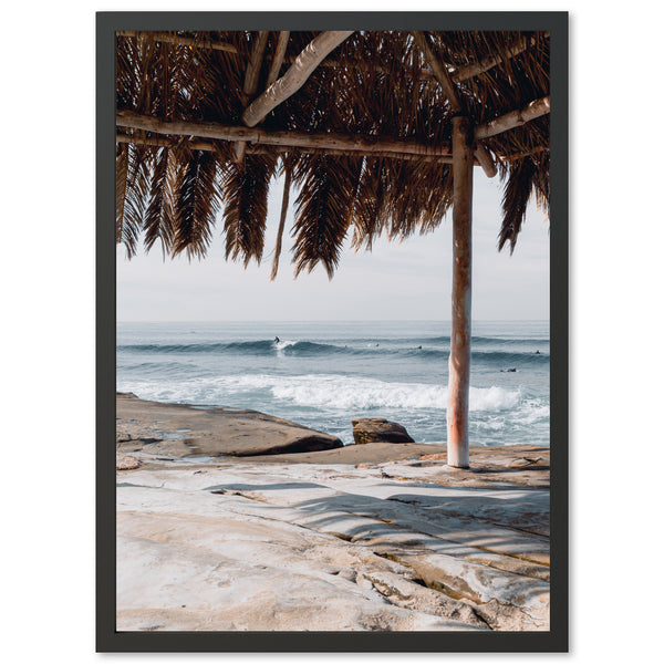 a view of the ocean from under a hut