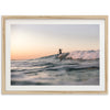 a person riding a wave on top of a surfboard