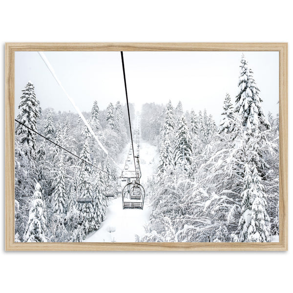 a ski lift in the middle of a snowy forest