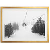 a black and white photo of a ski lift