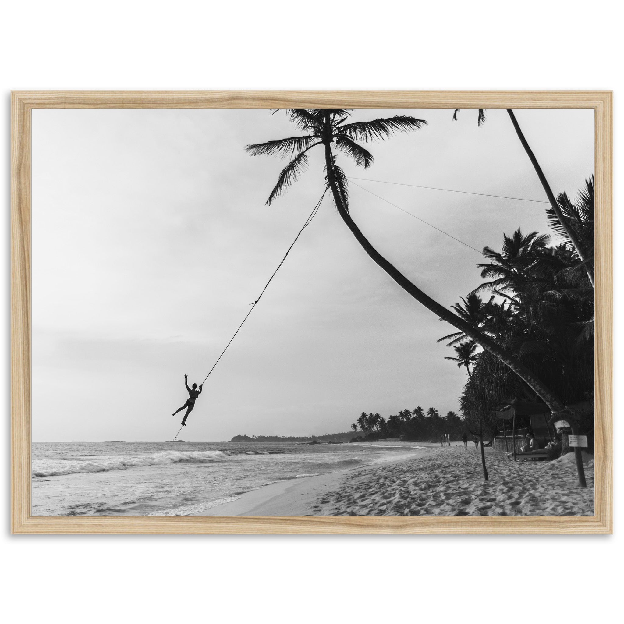 a black and white photo of a person on a rope