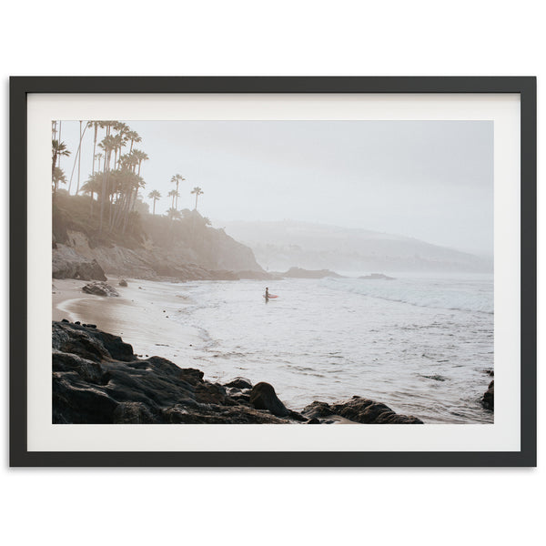 a picture of a person on a surfboard in the ocean