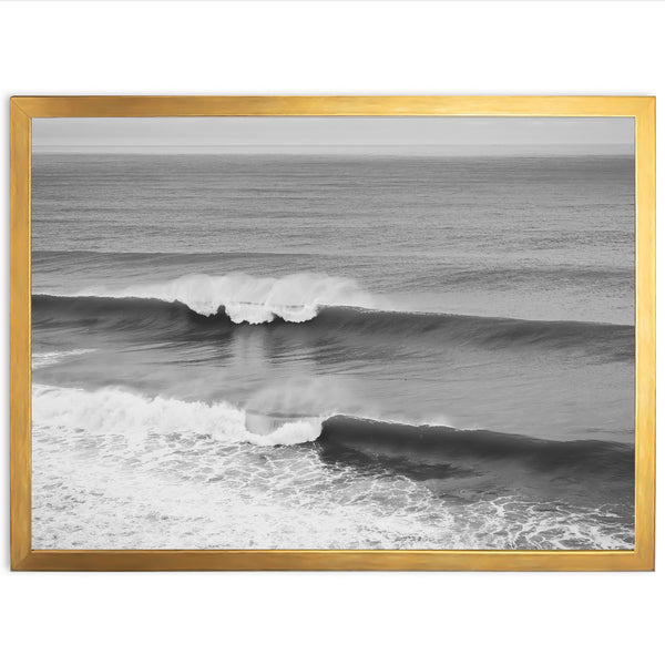 a black and white photo of a wave in the ocean