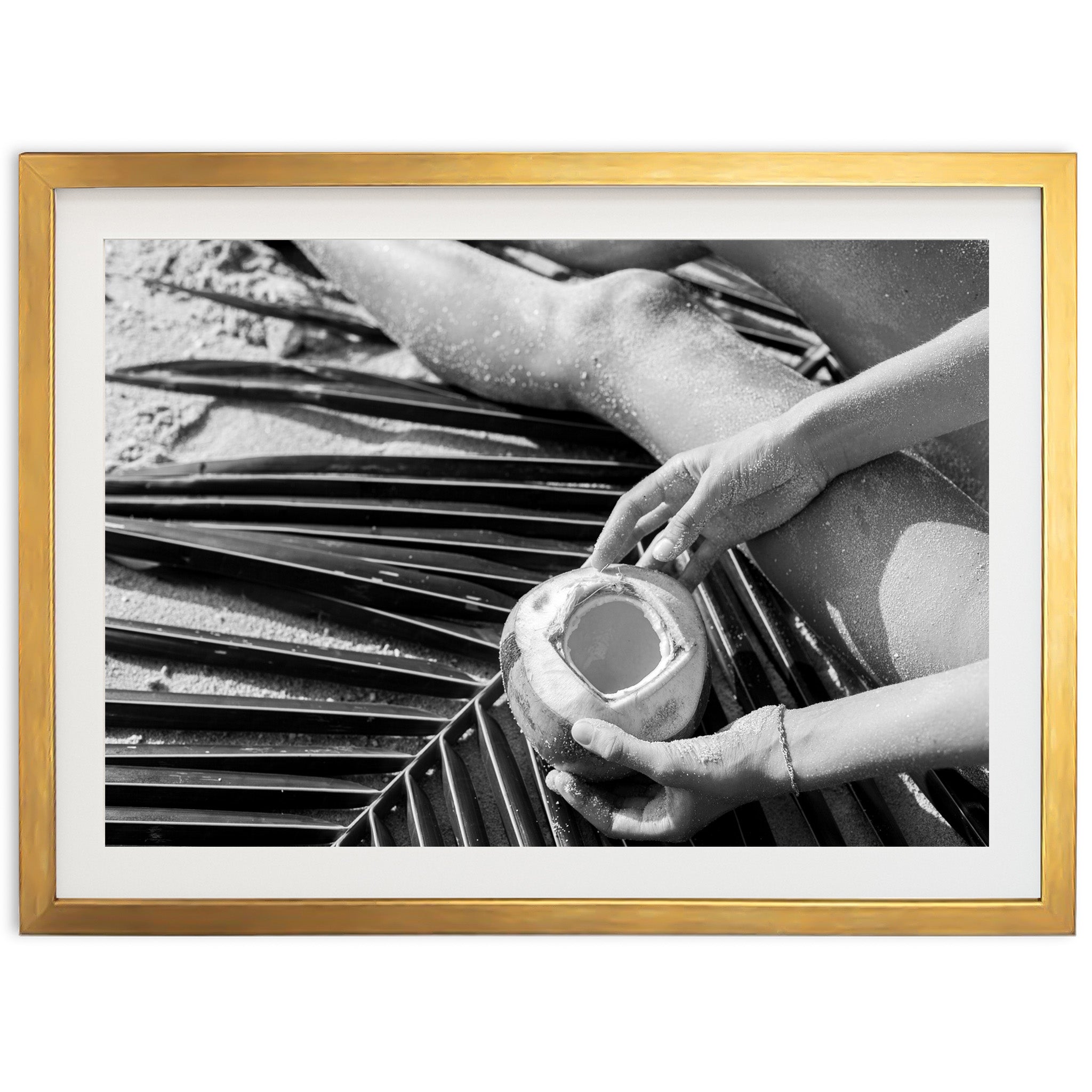 a black and white photo of a person holding a cup