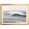 a black and white photo of a large wave