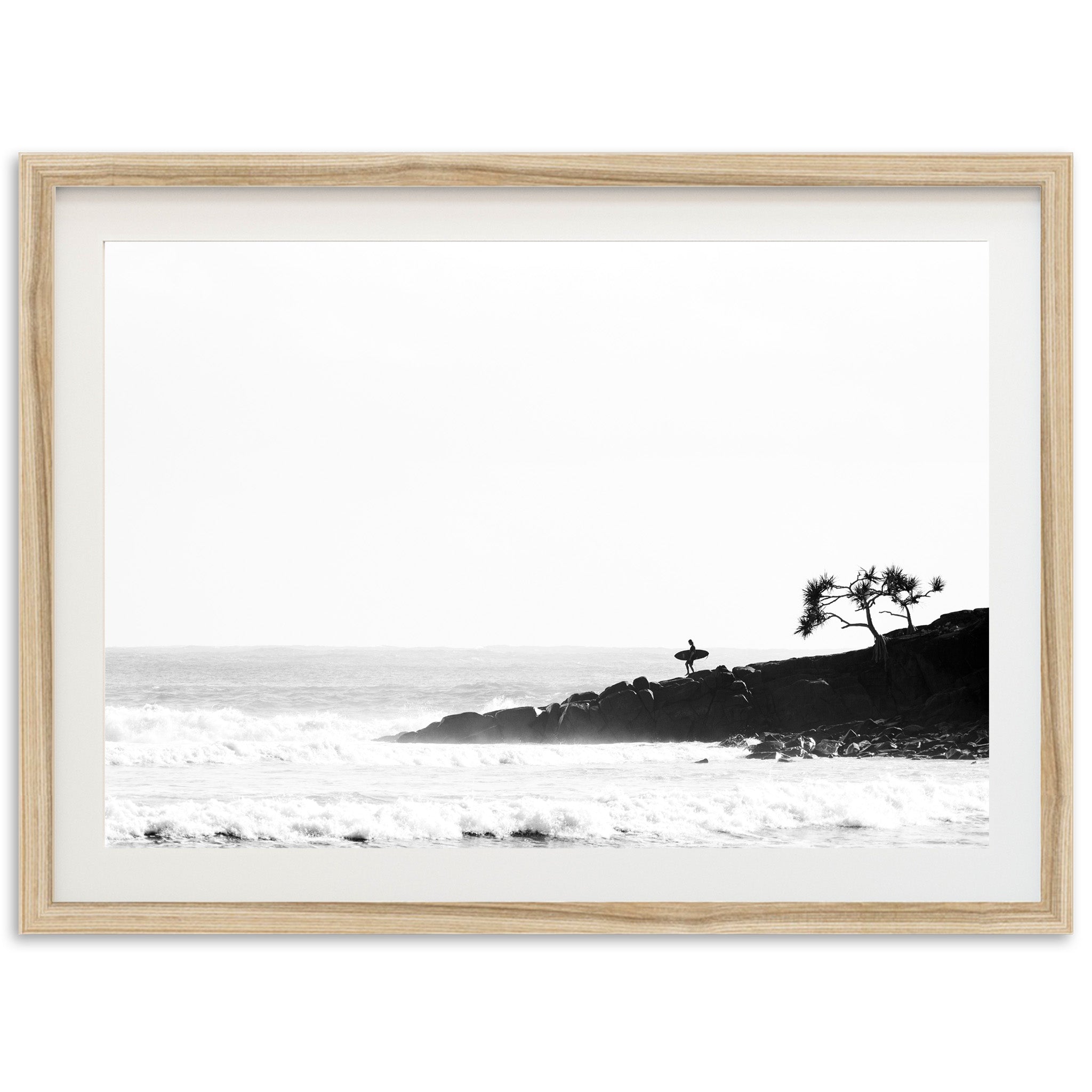 a black and white photo of a beach with waves