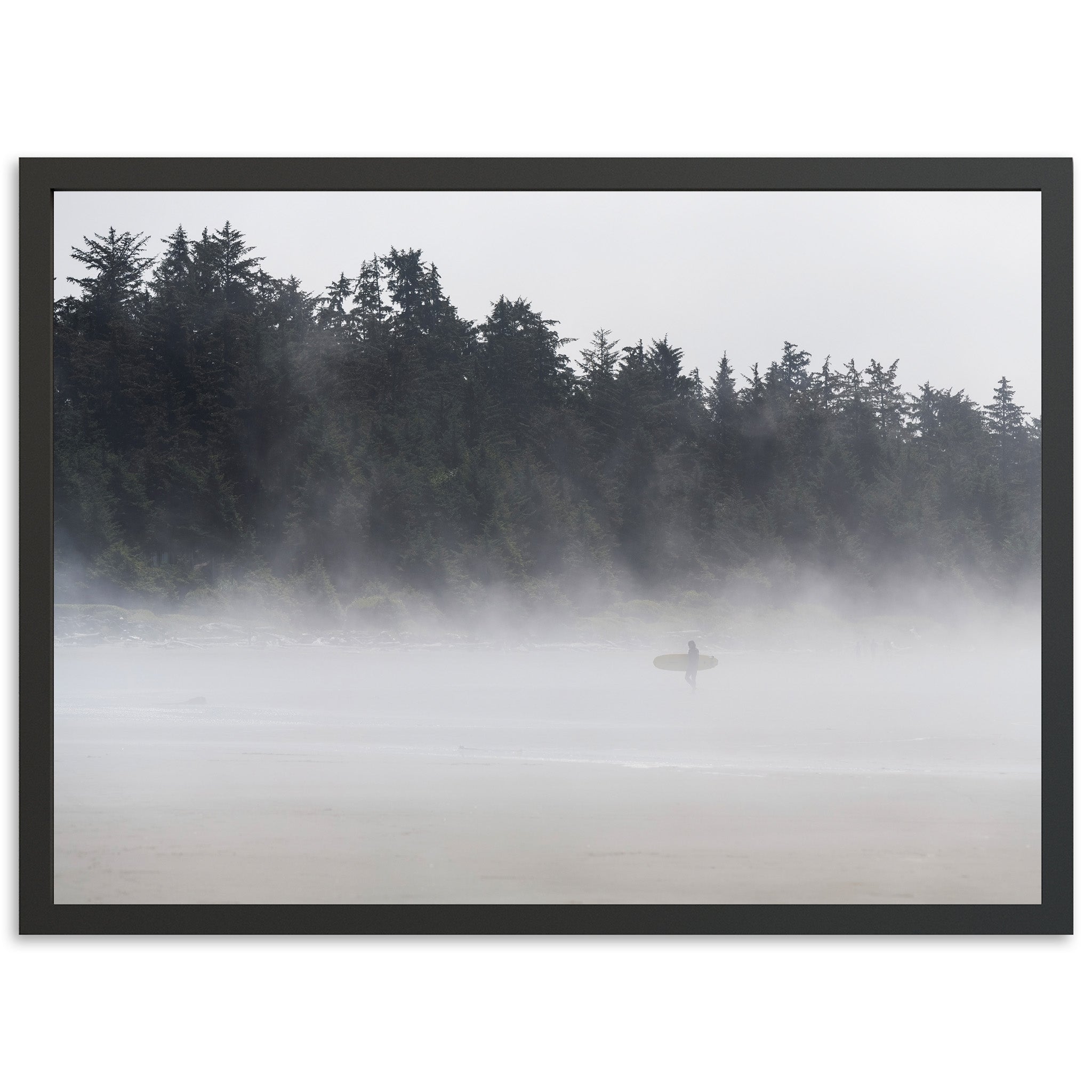 a person with a surfboard on a foggy beach