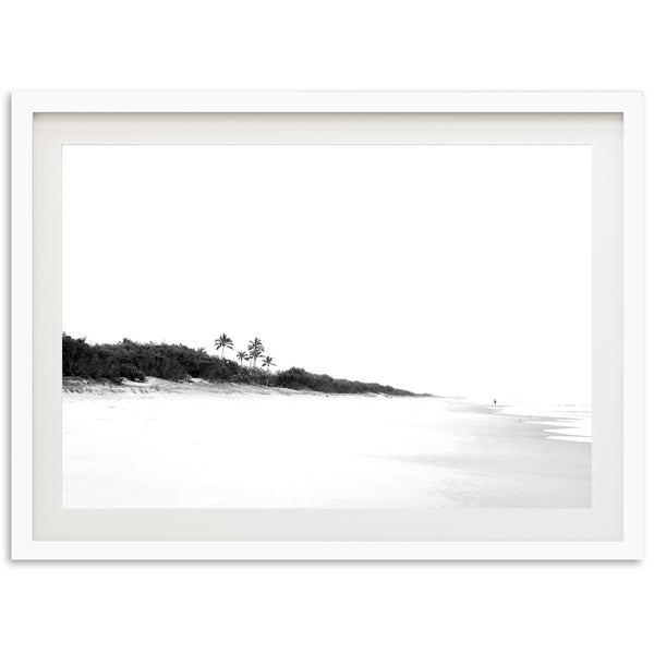 a black and white photo of a beach