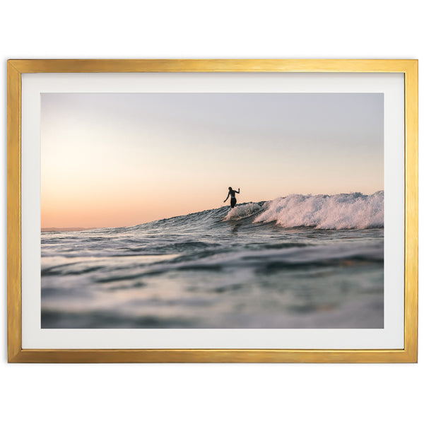 a man riding a wave on top of a surfboard