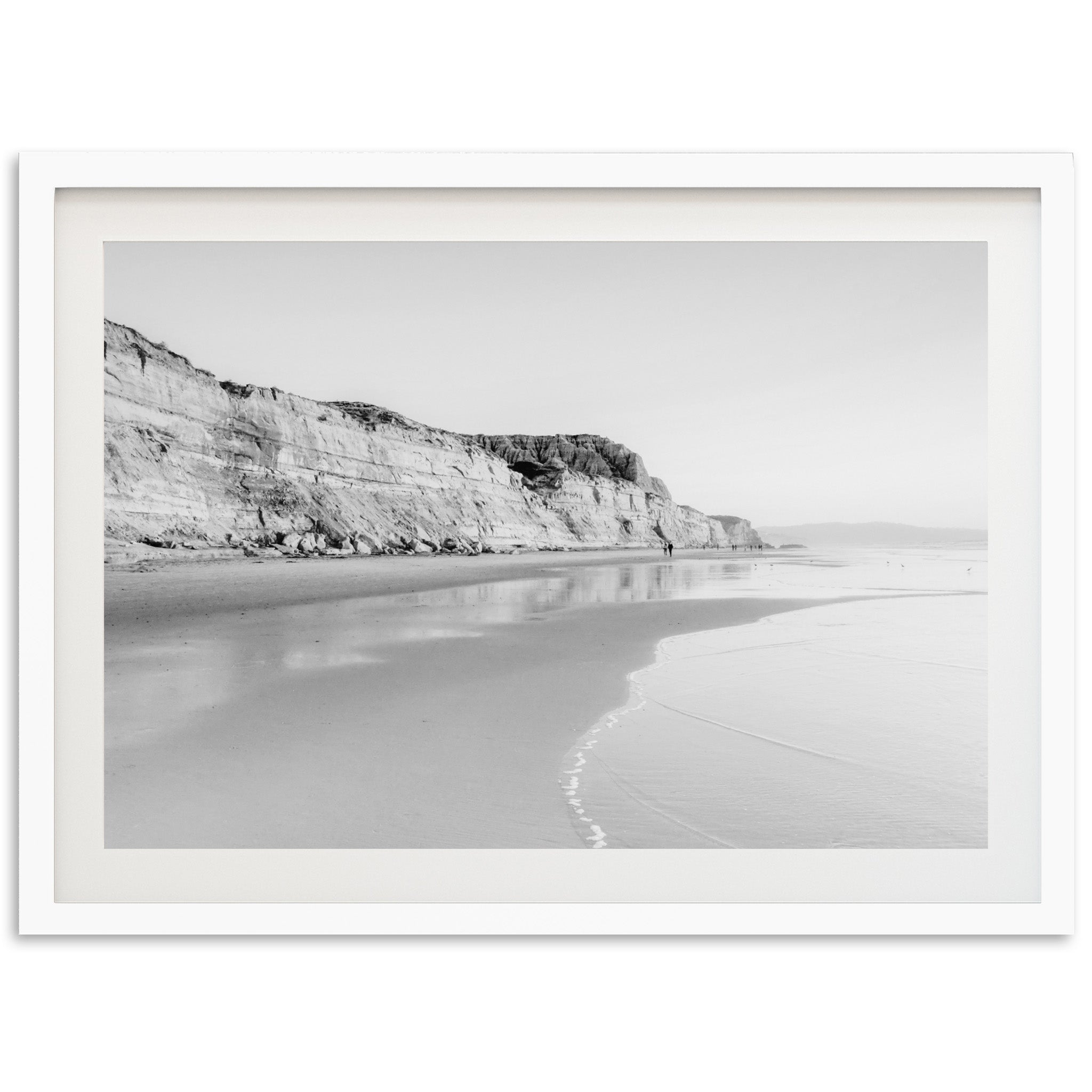 a black and white photo of a beach