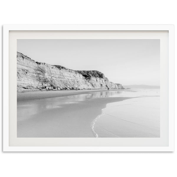 a black and white photo of a beach