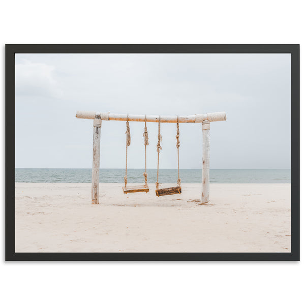 a picture of a swing set on the beach