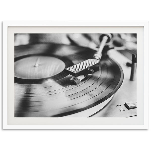 a black and white photo of a record player