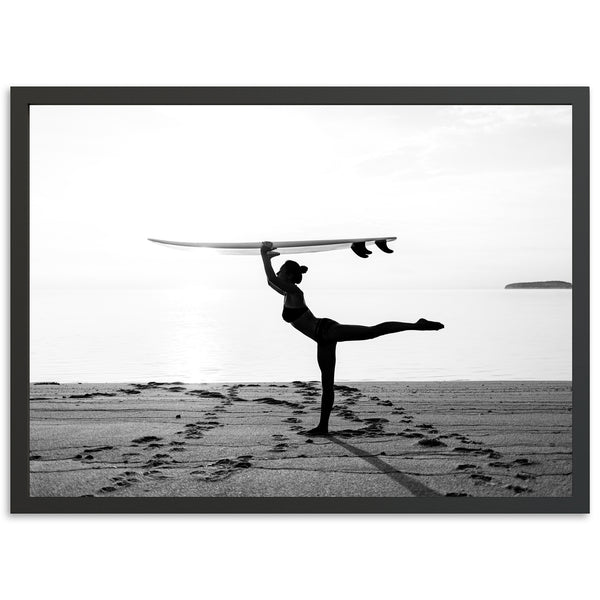 a man holding a surfboard over his head on a beach