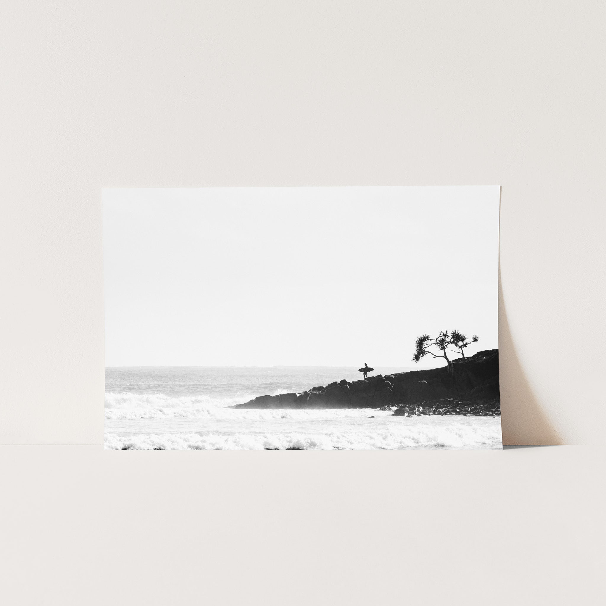 a black and white photo of a beach