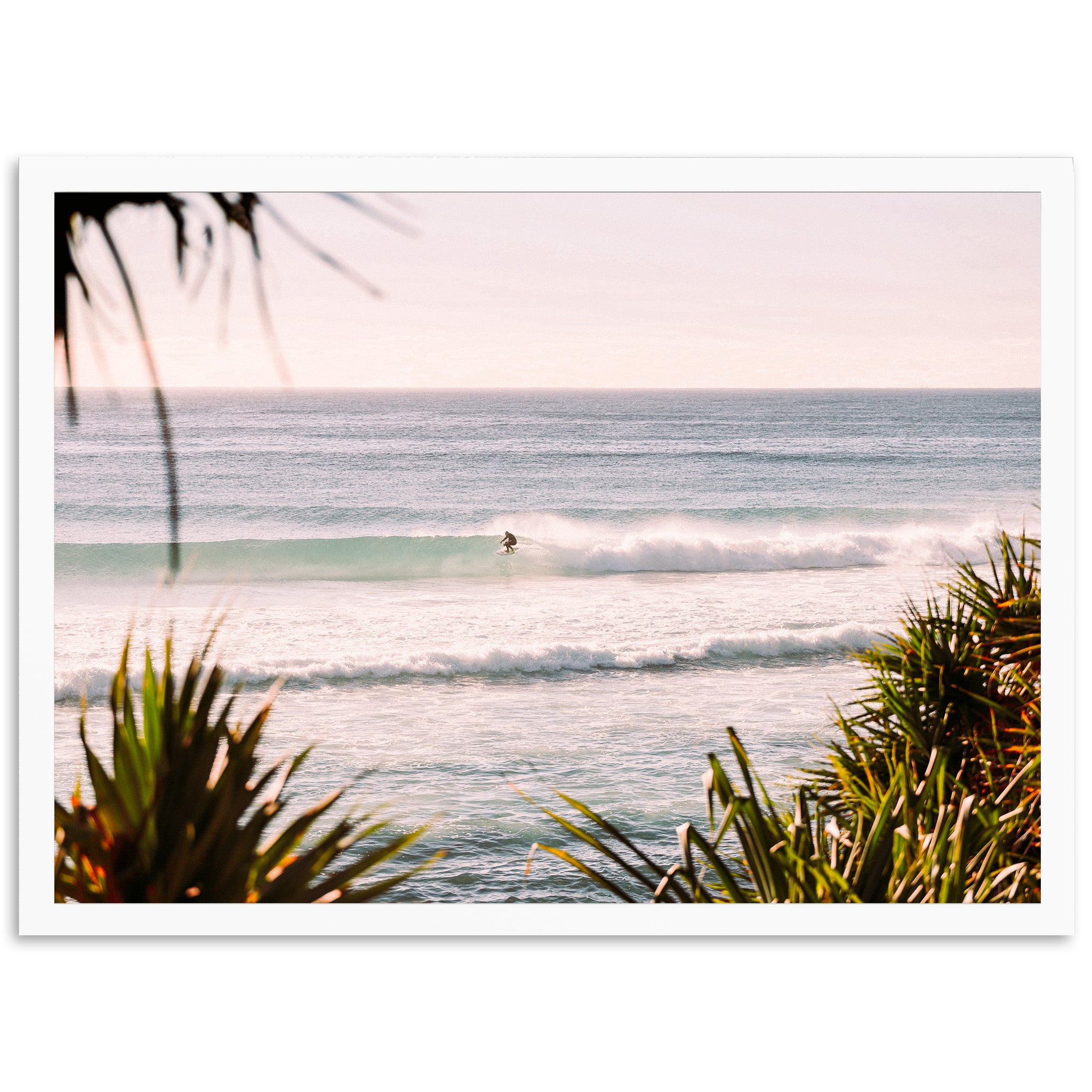 a person riding a surfboard on a wave in the ocean