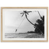 a black and white photo of a person on a rope