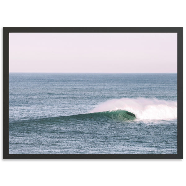 a surfer riding a wave in the ocean