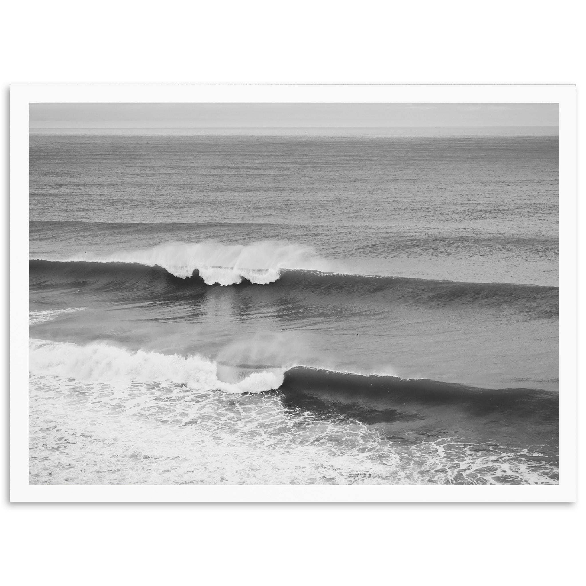 a black and white photo of a wave in the ocean