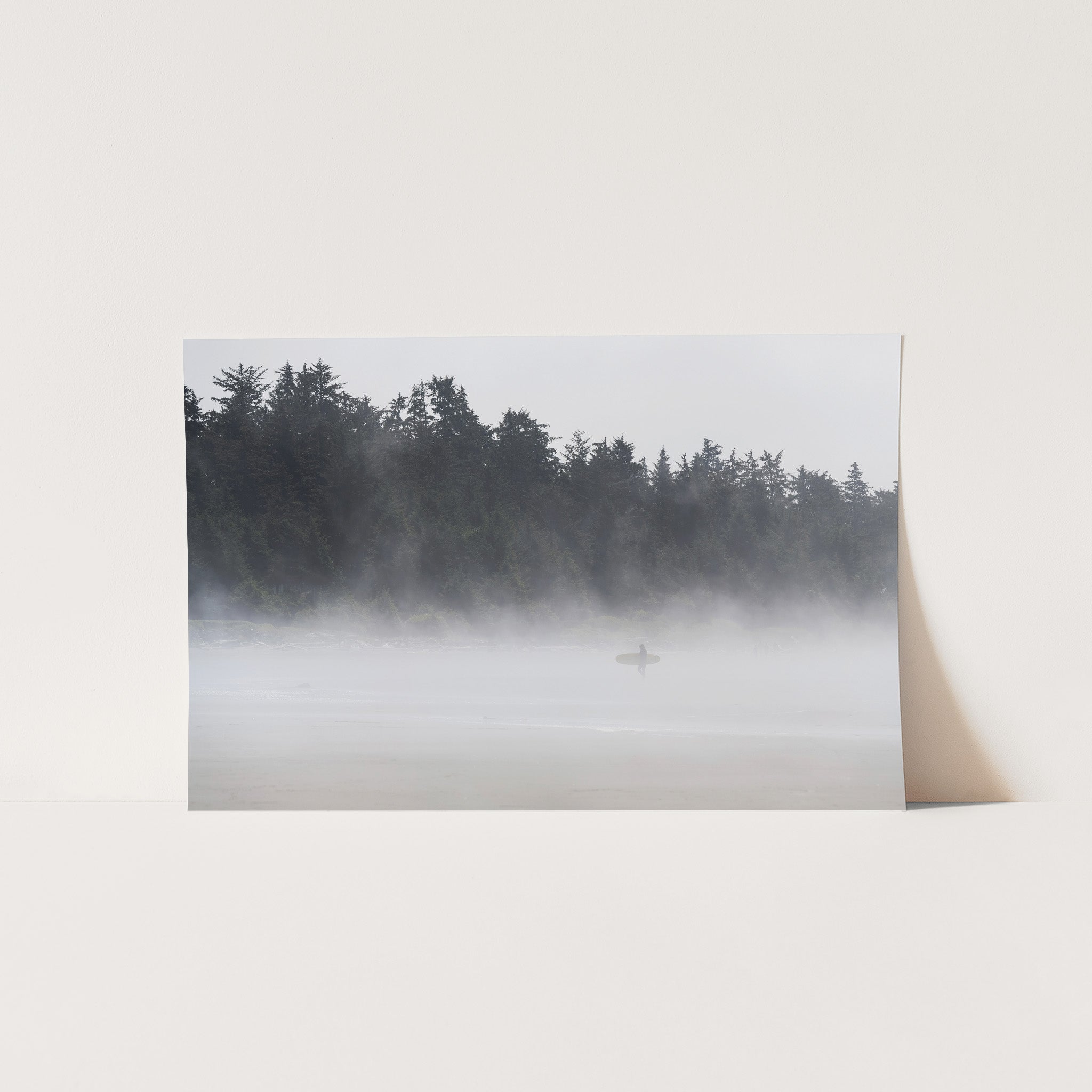 a picture of a foggy lake with a lone boat