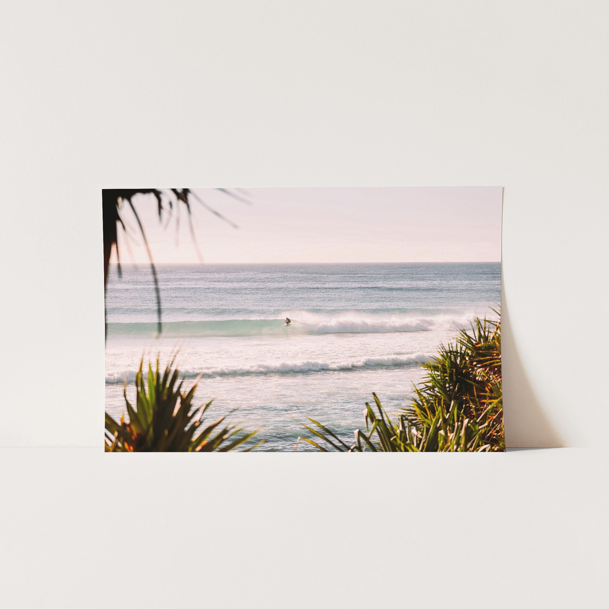 a picture of a surfer riding a wave in the ocean