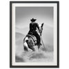 a black and white photo of a cowboy on a horse