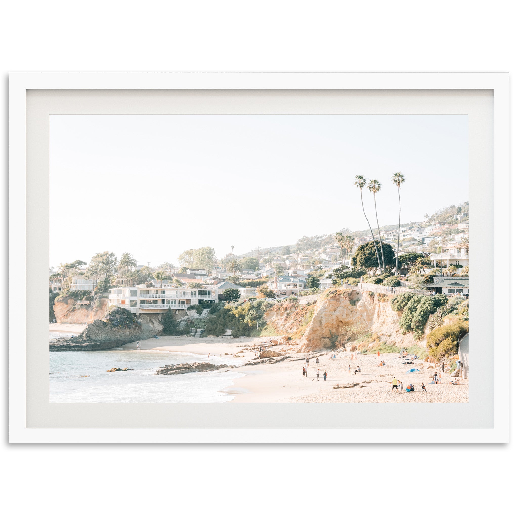 a picture of a beach with people walking on it