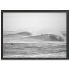 a black and white photo of a surfer riding a wave