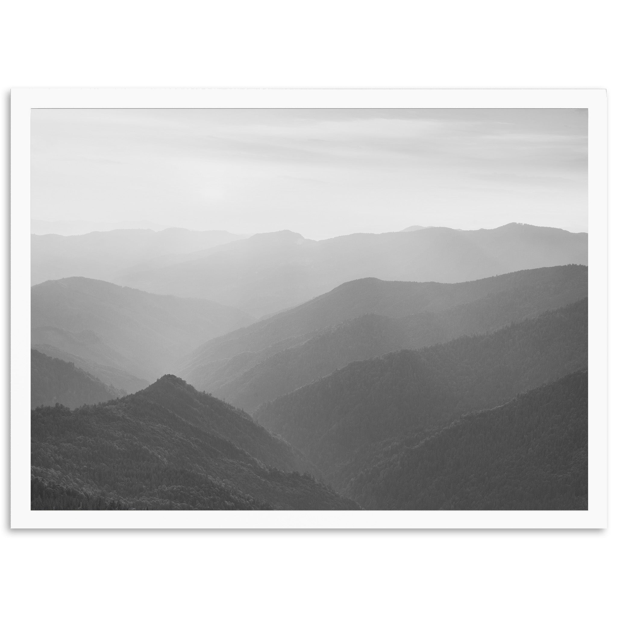 a black and white photo of a mountain range